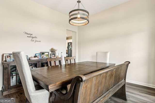 102 Olson Way, Kingsland, GA 31548 - dining area featuring baseboards, a chandelier, and dark wood-type flooring