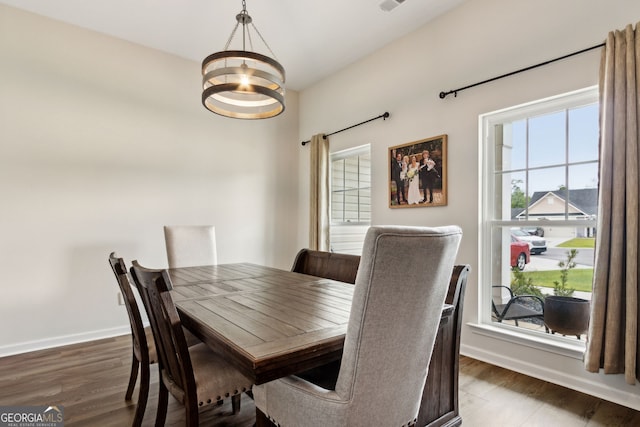 102 Olson Way, Kingsland, GA 31548 - dining space featuring a chandelier, wood finished floors, and baseboards