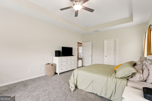 102 Olson Way, Kingsland, GA 31548 - carpeted bedroom featuring baseboards, a raised ceiling, and a ceiling fan