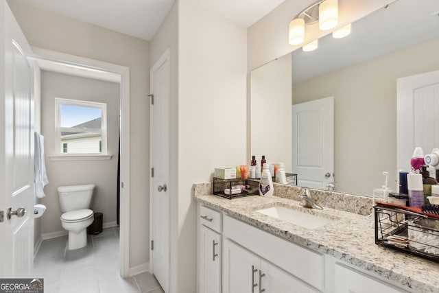 102 Olson Way, Kingsland, GA 31548 - bathroom featuring vanity, toilet, tile patterned flooring, and baseboards