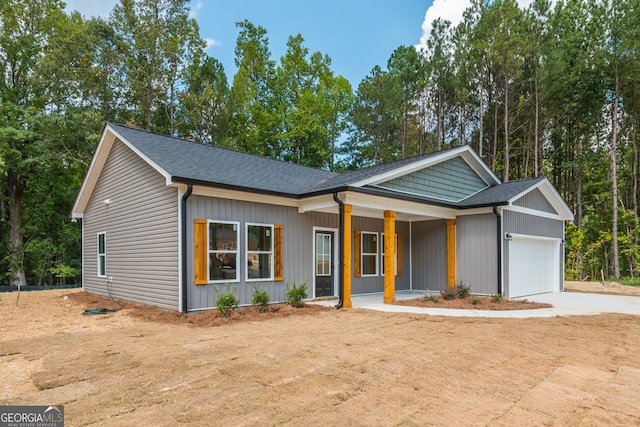 246 Stephens Rd, Cedartown, GA 30125 - view of front of property featuring covered porch, an attached garage, concrete driveway, and a shingled roof
