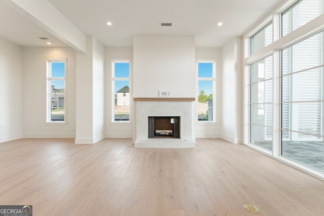 260 Guild Ln, Fayetteville, GA 30214 - unfurnished living room with light wood-type flooring, a fireplace, and recessed lighting
