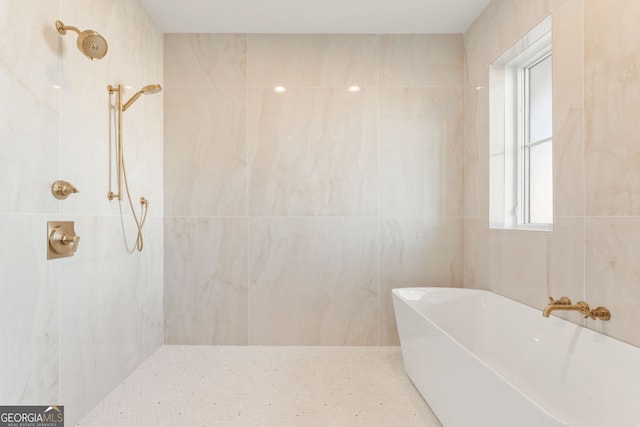 260 Guild Ln, Fayetteville, GA 30214 - bathroom with a tile shower and a freestanding tub