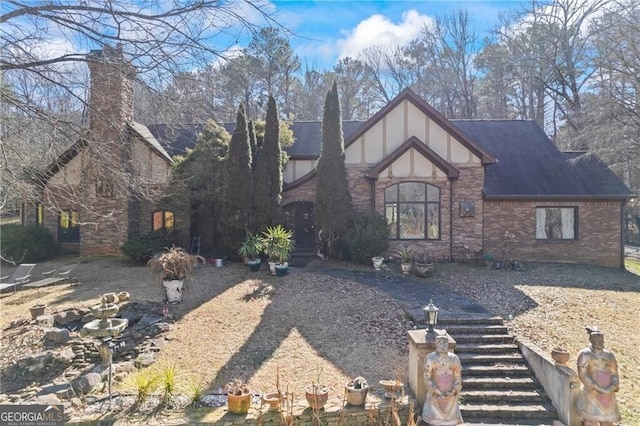 3000 Cathedral Pl, Decatur, GA 30034 - tudor house featuring a chimney and brick siding