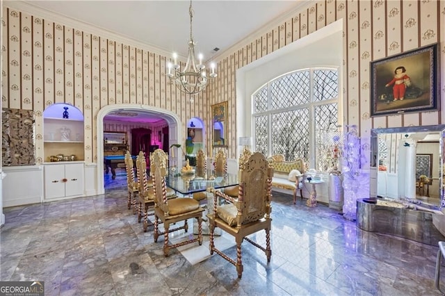 3000 Cathedral Pl, Decatur, GA 30034 - dining space with wallpapered walls, a chandelier, crown molding, arched walkways, and marble tiled flooring