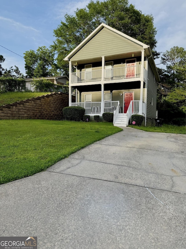 2650 Batavia St, East Point, GA 30344 - view of front of house with a porch, a front lawn, and concrete driveway