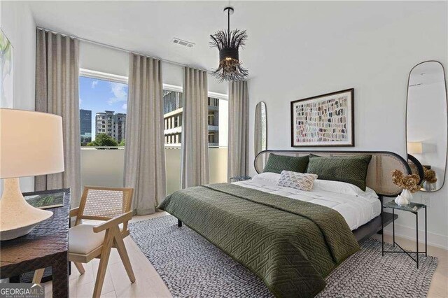 775 Juniper St NE Unit 111, Atlanta, GA 30308 - bedroom featuring wood finished floors and a view of city