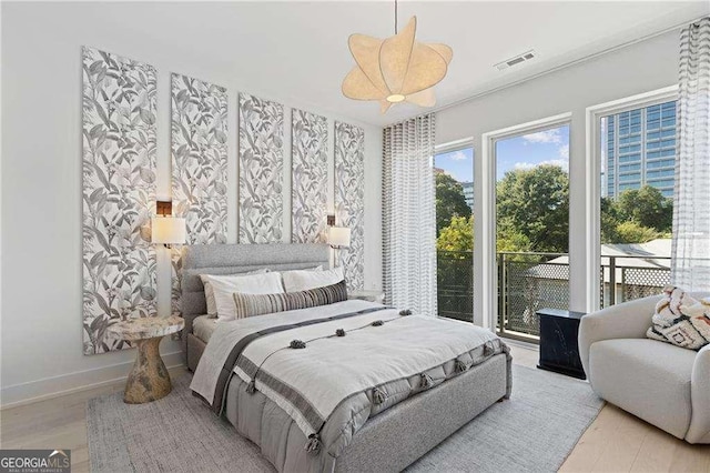 775 Juniper St NE Unit 111, Atlanta, GA 30308 - bedroom featuring light wood-type flooring and baseboards