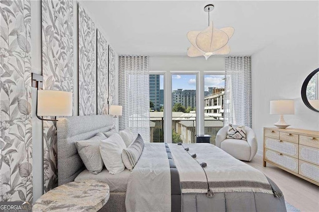 775 Juniper St NE Unit 111, Atlanta, GA 30308 - bedroom featuring wood finished floors and baseboards