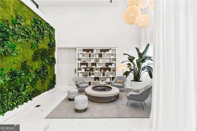 775 Juniper St NE Unit 111, Atlanta, GA 30308 - living area with marble finish floors