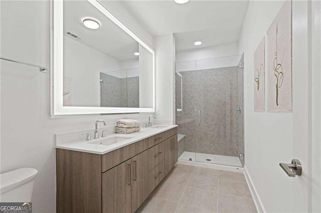 775 Juniper St NE Unit 111, Atlanta, GA 30308 - full bathroom featuring a stall shower, double vanity, tile patterned floors, and recessed lighting