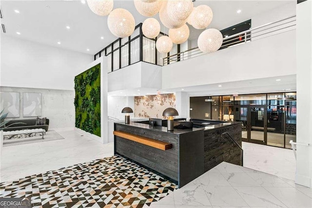 775 Juniper St NE Unit 111, Atlanta, GA 30308 - welcome area featuring a towering ceiling and recessed lighting