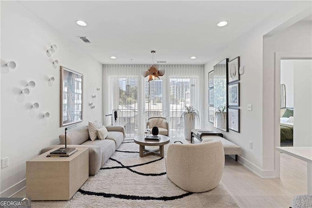 775 Juniper St NE Unit 111, Atlanta, GA 30308 - living area with recessed lighting and light wood-type flooring
