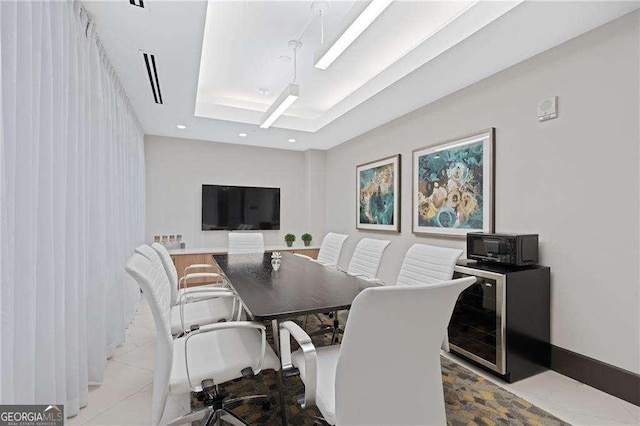775 Juniper St NE Unit 111, Atlanta, GA 30308 - dining space with a tray ceiling, wine cooler, recessed lighting, and tile patterned floors