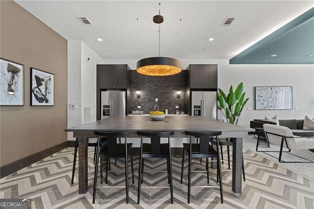 775 Juniper St NE Unit 111, Atlanta, GA 30308 - kitchen with high end refrigerator, pendant lighting, and recessed lighting