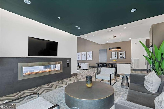 775 Juniper St NE Unit 111, Atlanta, GA 30308 - carpeted living area featuring a multi sided fireplace and recessed lighting