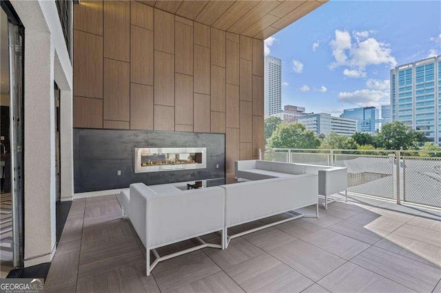 775 Juniper St NE Unit 111, Atlanta, GA 30308 - view of patio featuring an outdoor living space with a fireplace and a view of city