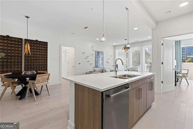 775 Juniper St NE Unit 111, Atlanta, GA 30308 - kitchen with stainless steel dishwasher, modern cabinets, a center island with sink, light wood-type flooring, and recessed lighting