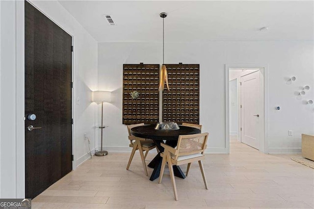 775 Juniper St NE Unit 111, Atlanta, GA 30308 - dining area featuring light wood-style flooring