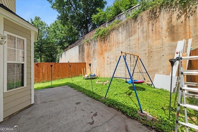 1955 Shawn Wayne Cir SE, Atlanta, GA 30316 - fenced backyard featuring a patio area and a playground