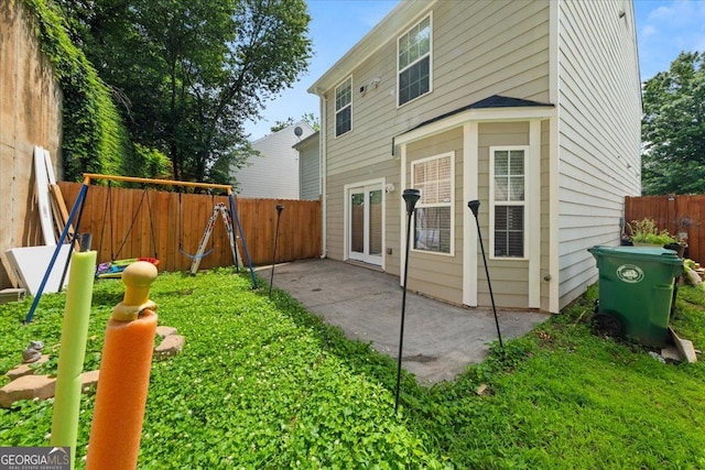 1955 Shawn Wayne Cir SE, Atlanta, GA 30316 - back of house featuring a fenced backyard, a patio area, and a playground