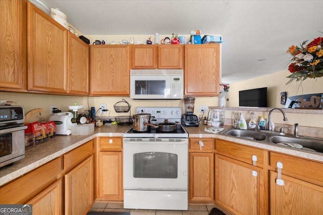 1955 Shawn Wayne Cir SE, Atlanta, GA 30316 - kitchen with white appliances, light tile patterned floors, and light countertops
