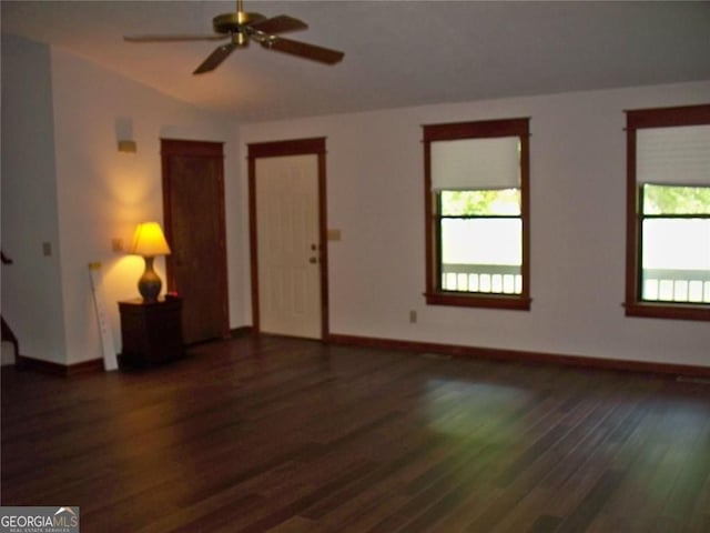 219 Park Ave, Woodstock, GA 30188 - unfurnished living room with wood finished floors, plenty of natural light, and a ceiling fan