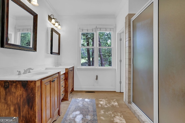 2216 Trammel Rd, Cumming, GA 30041 - full bath with vanity, wood finished floors, a shower stall, and ornamental molding