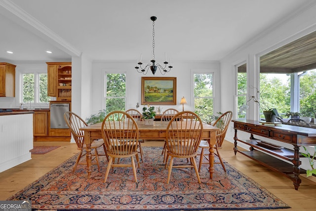 2216 Trammel Rd, Cumming, GA 30041 - dining room featuring crown molding, light wood finished floors, a chandelier, healthy amount of natural light, and recessed lighting