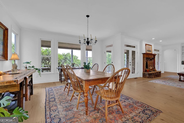 2216 Trammel Rd, Cumming, GA 30041 - dining area with healthy amount of natural light, a chandelier, light wood-type flooring, and recessed lighting