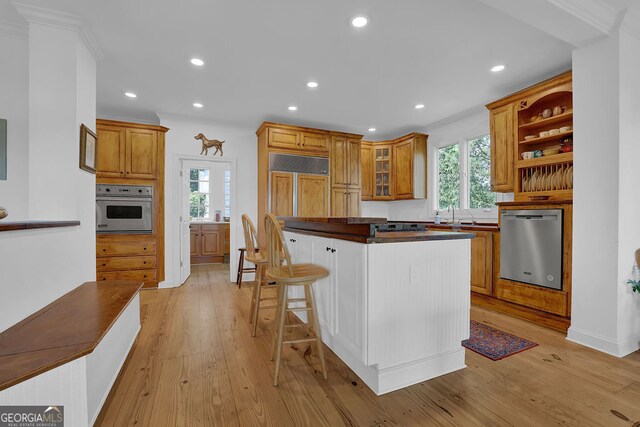 2216 Trammel Rd, Cumming, GA 30041 - kitchen with stainless steel appliances, dark countertops, healthy amount of natural light, light wood-type flooring, and recessed lighting