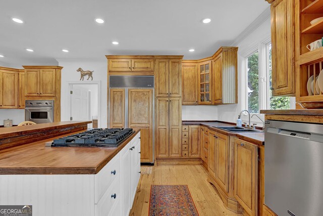2216 Trammel Rd, Cumming, GA 30041 - kitchen featuring stainless steel appliances, open shelves, recessed lighting, light wood-type flooring, and glass insert cabinets