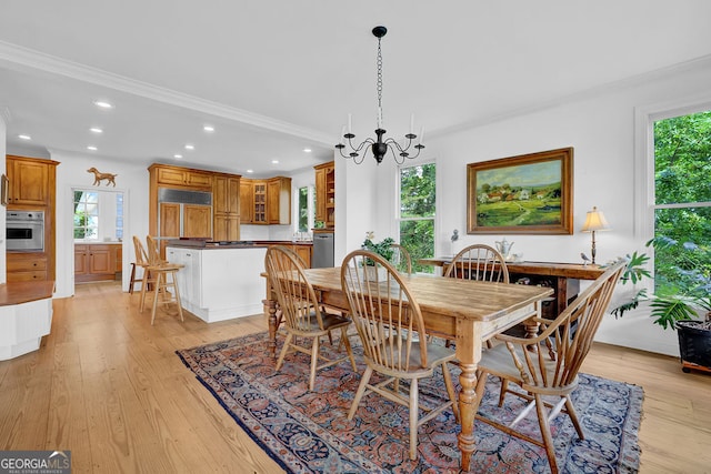 2216 Trammel Rd, Cumming, GA 30041 - dining room with recessed lighting, plenty of natural light, light wood-style flooring, a chandelier, and crown molding
