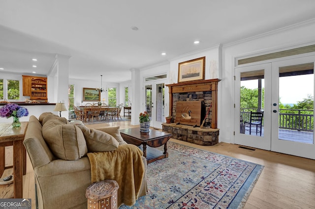2216 Trammel Rd, Cumming, GA 30041 - living area with french doors, ornamental molding, healthy amount of natural light, recessed lighting, and light wood finished floors