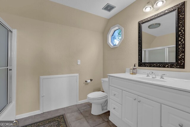 2216 Trammel Rd, Cumming, GA 30041 - full bathroom featuring vanity, tile patterned floors, a shower with door, and vaulted ceiling