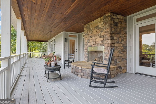 2216 Trammel Rd, Cumming, GA 30041 - wooden porch with an outdoor stone fireplace