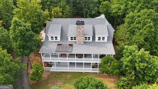 2216 Trammel Rd, Cumming, GA 30041 - back of house featuring a chimney, a balcony, and roof with shingles