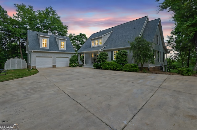 2216 Trammel Rd, Cumming, GA 30041 - view of front facade with a garage, concrete driveway, a shingled roof, and a shed