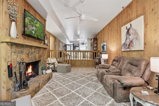 251 Shakespeare Dr Unit 332, Clayton, GA 30525 - carpeted living area featuring wood walls, a stone fireplace, and ceiling fan