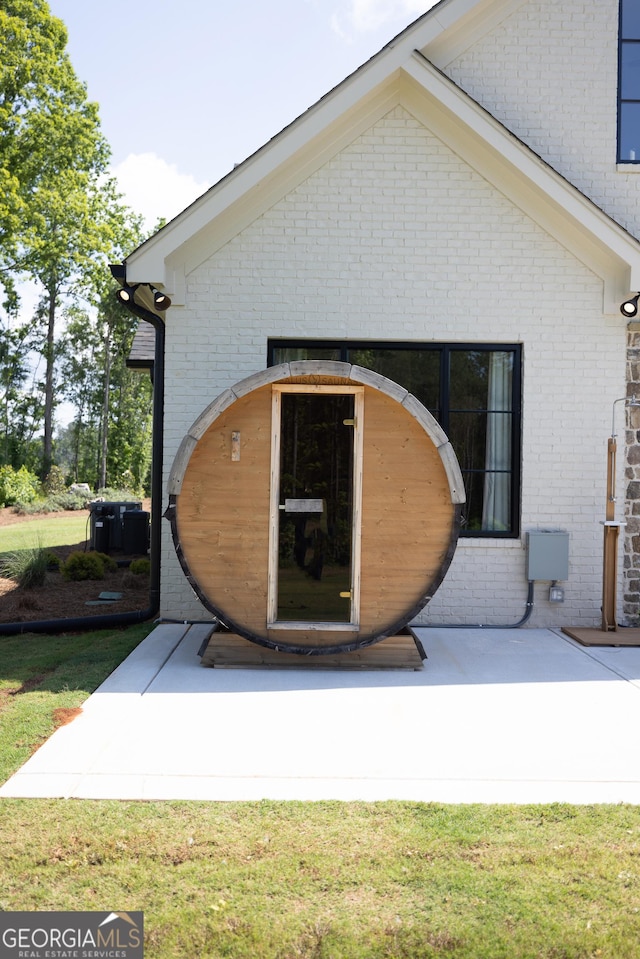 5700 Goolsby Rd, Monticello, GA 31064 - back of property with brick siding and a lawn