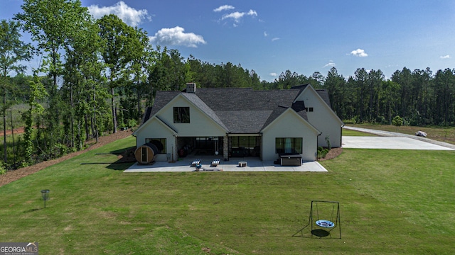5700 Goolsby Rd, Monticello, GA 31064 - view of front of property with a patio area, a front lawn, and a chimney