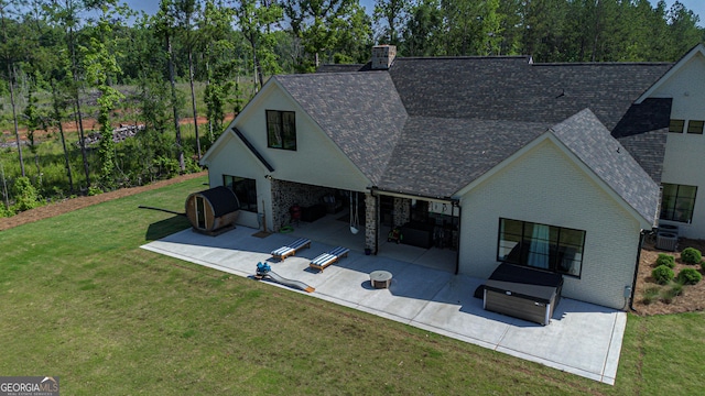 5700 Goolsby Rd, Monticello, GA 31064 - back of house featuring a patio area, a shingled roof, a lawn, central AC, and brick siding
