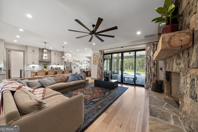 5700 Goolsby Rd, Monticello, GA 31064 - living room featuring a ceiling fan, recessed lighting, wood finished floors, and a fireplace