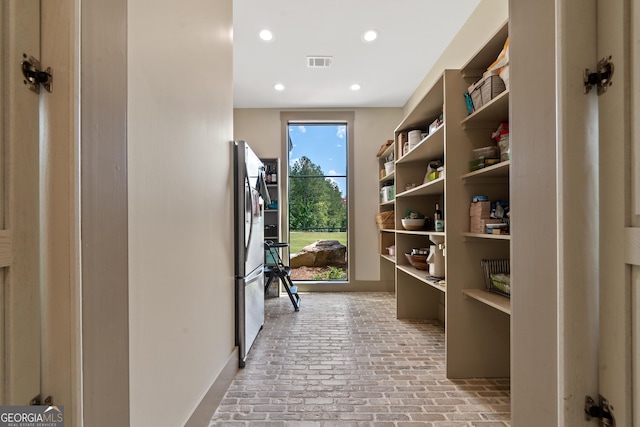 5700 Goolsby Rd, Monticello, GA 31064 - corridor with brick floors and recessed lighting