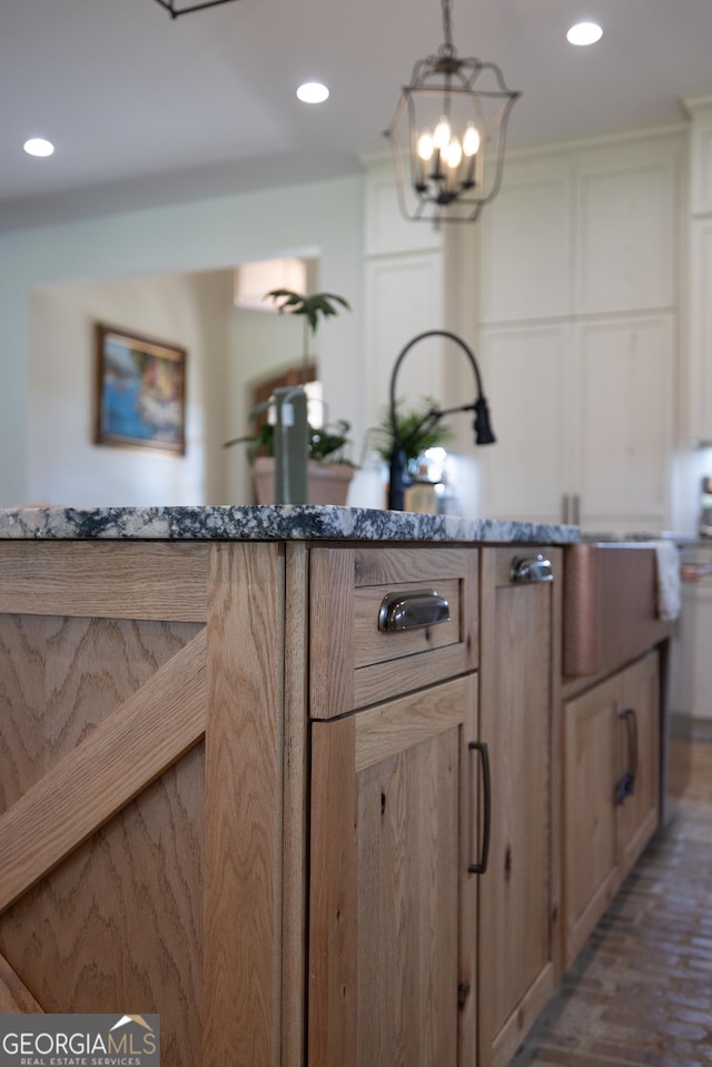 5700 Goolsby Rd, Monticello, GA 31064 - kitchen with recessed lighting, a chandelier, light stone countertops, white cabinetry, and decorative light fixtures