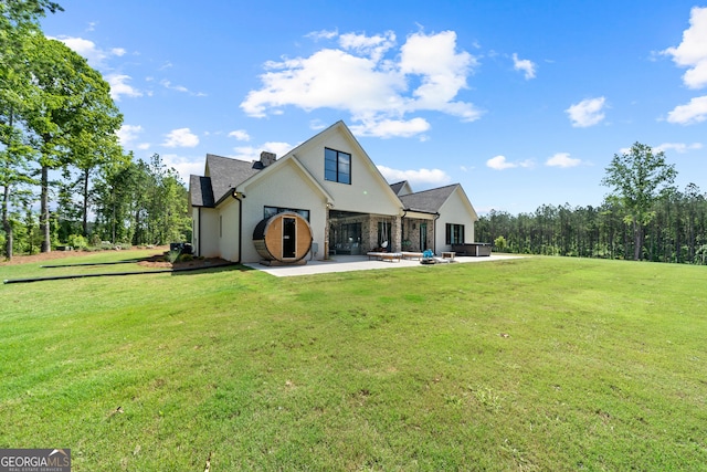 5700 Goolsby Rd, Monticello, GA 31064 - back of property featuring a patio, a yard, and a chimney
