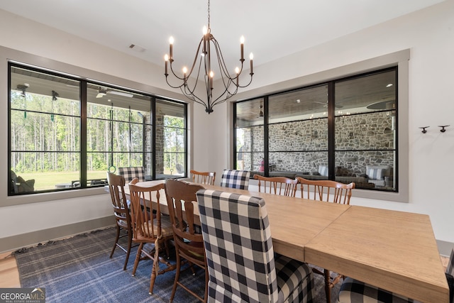 5700 Goolsby Rd, Monticello, GA 31064 - dining space with a chandelier and baseboards