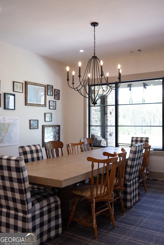 5700 Goolsby Rd, Monticello, GA 31064 - carpeted dining room featuring a chandelier
