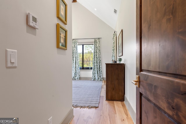 5700 Goolsby Rd, Monticello, GA 31064 - hall with baseboards, high vaulted ceiling, and light wood finished floors