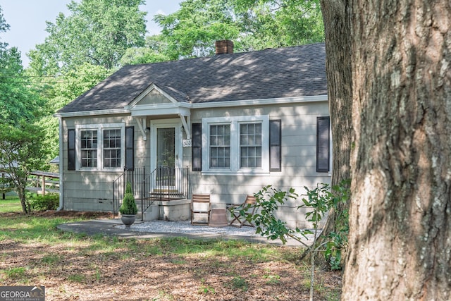 380 Best Dr, Athens, GA 30606 - view of front of home featuring a shingled roof, a chimney, and crawl space